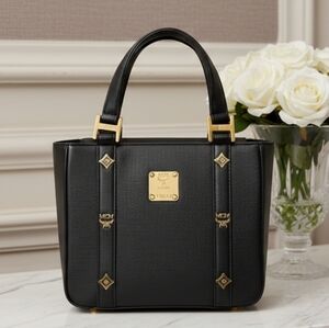 MCM Black Tote Bag with Gold Accents